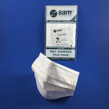 Load image into Gallery viewer, SAM self adhesive mask shown standing beside a packaged SAM in cellophane with a wet wipe visible through the clear window.